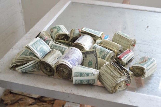 Photographer Finds stash of money in an abandoned house