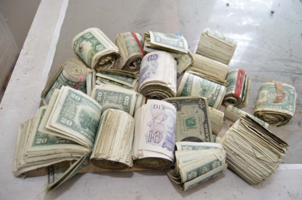 Photographer Finds stash of money in an abandoned house
