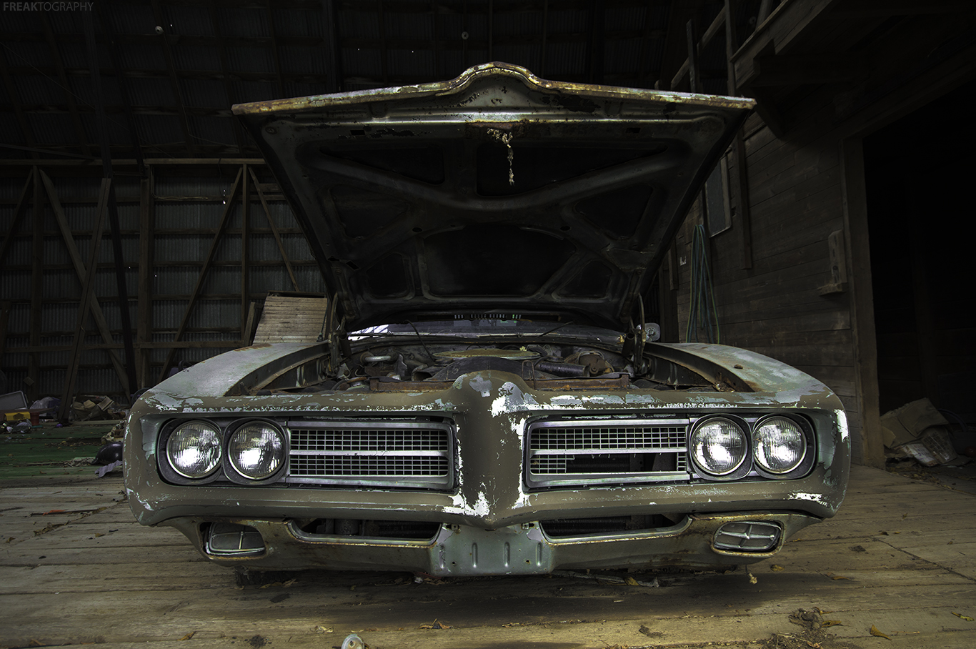 An abandoned car found in the barn of an old derelct house in Ontario Canada.