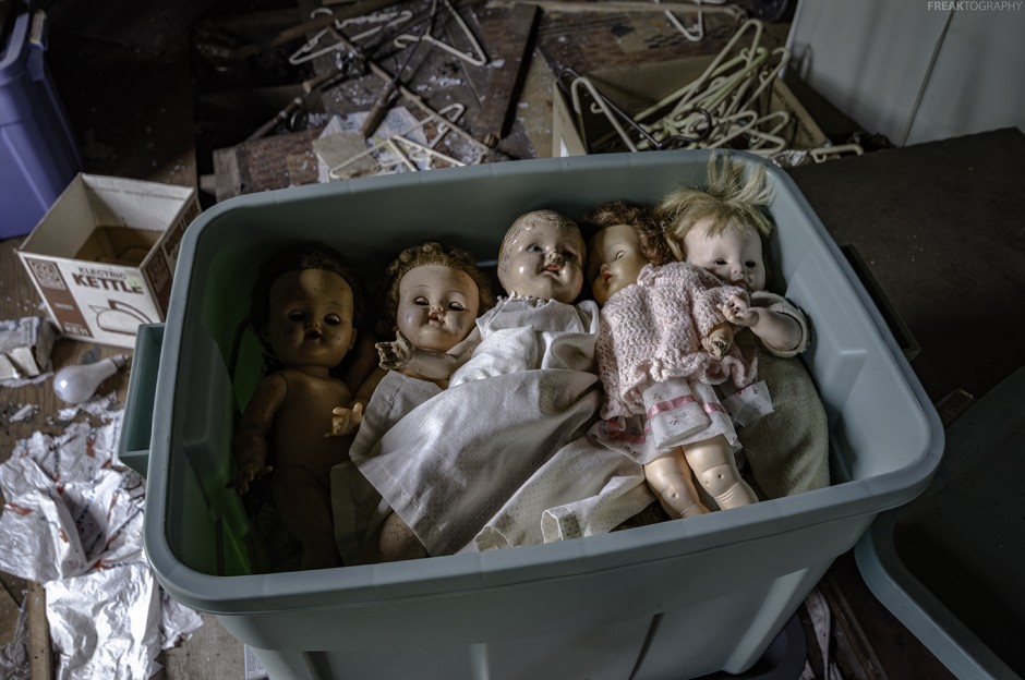 dolls in an abandoned house attic