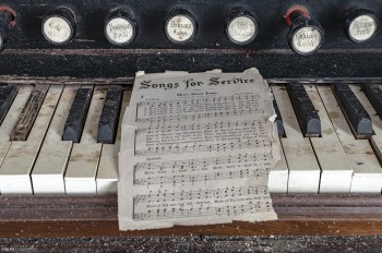 sheet music in an abandoned church