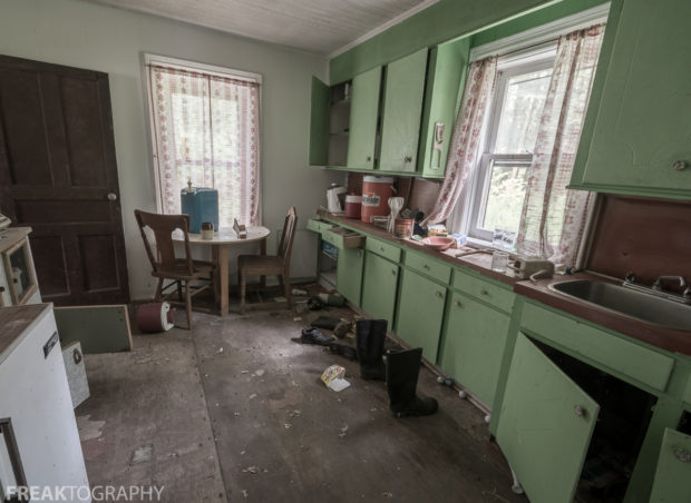 Bright green kitchen in the perfectly preserved abandoned time capsule house. Urban Exploring Gallery of a Perfectly Preserved Abandoned Time Capsule House in Ontario, Canada by Freaktography. Canadian Urban Exploration Photographer