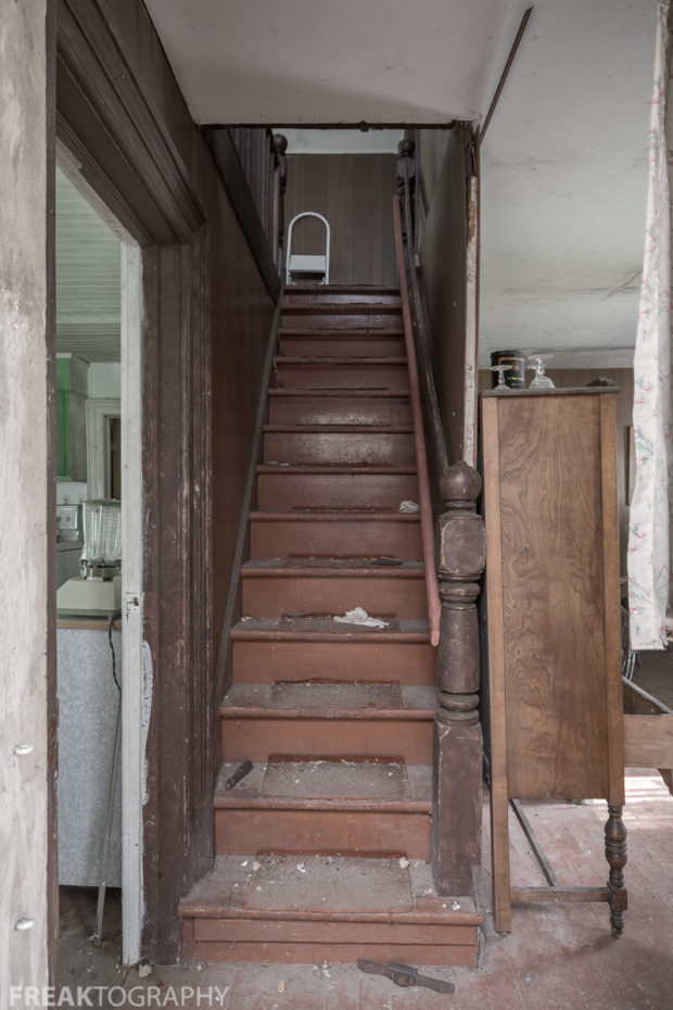 Stairway in the perfectly preserved abandoned time capsule house. Urban Exploring Gallery of a Perfectly Preserved Abandoned Time Capsule House in Ontario, Canada by Freaktography. Canadian Urban Exploration Photographer