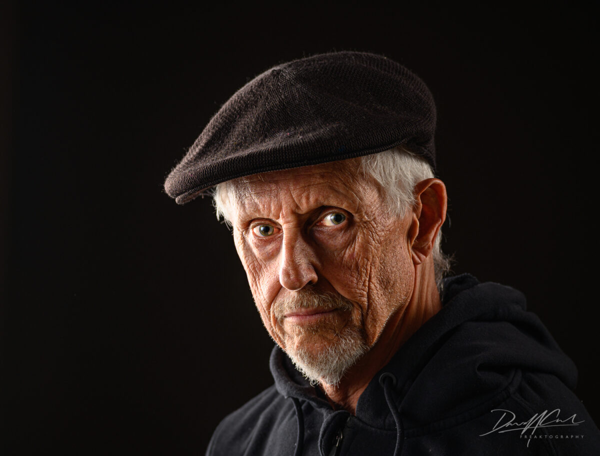 gritty portrait photograph of an older man