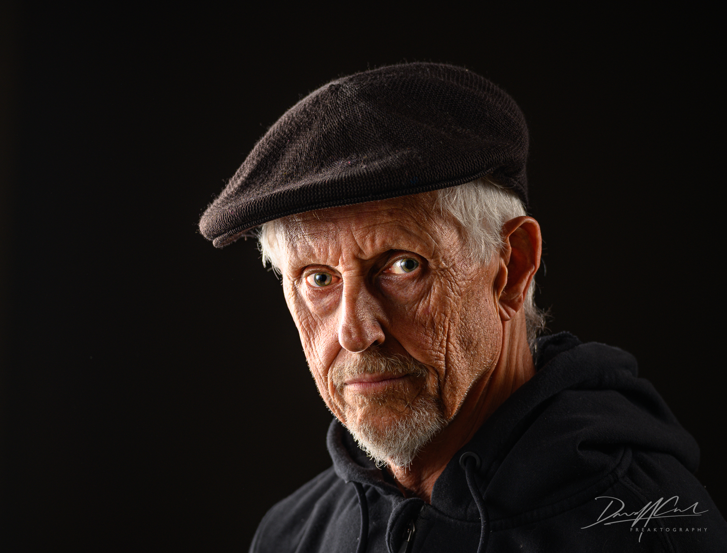 gritty portrait photograph of an older man