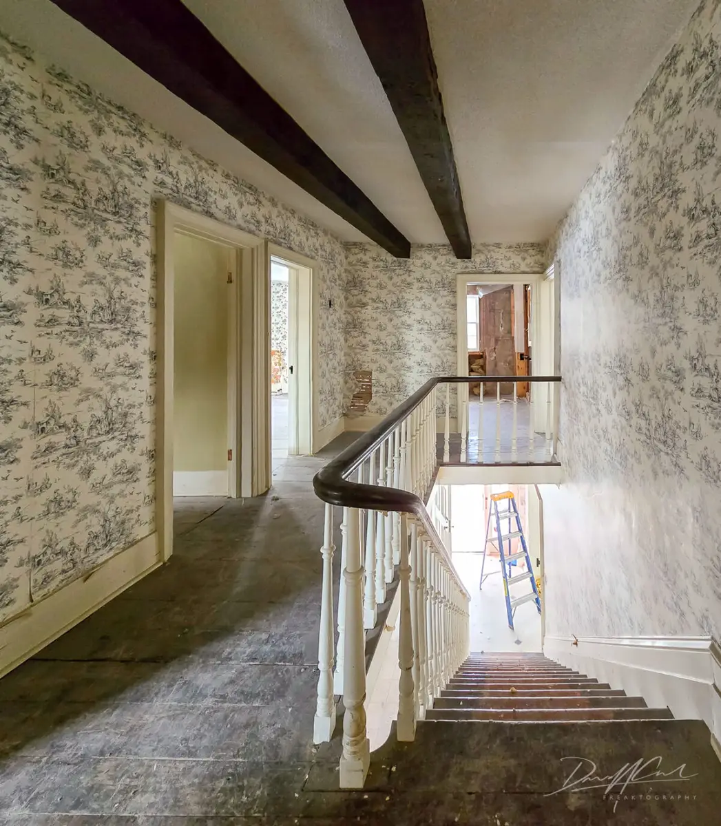 Photo of the demolished Oakville heritage home at 1475 Lakeshore Road East, originally built in 1830 and once known as the “Halfway House.” Despite protection under the Ontario Heritage Act, this two-storey colonial-style building was torn down in 2025, leaving behind rubble and a felled tree. Documenting abandoned places, abandoned buildings, and lost history in Ontario, Canada.