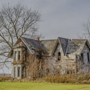 The Abandoned Guyitt House: Weathered Wooden House Prairie Print